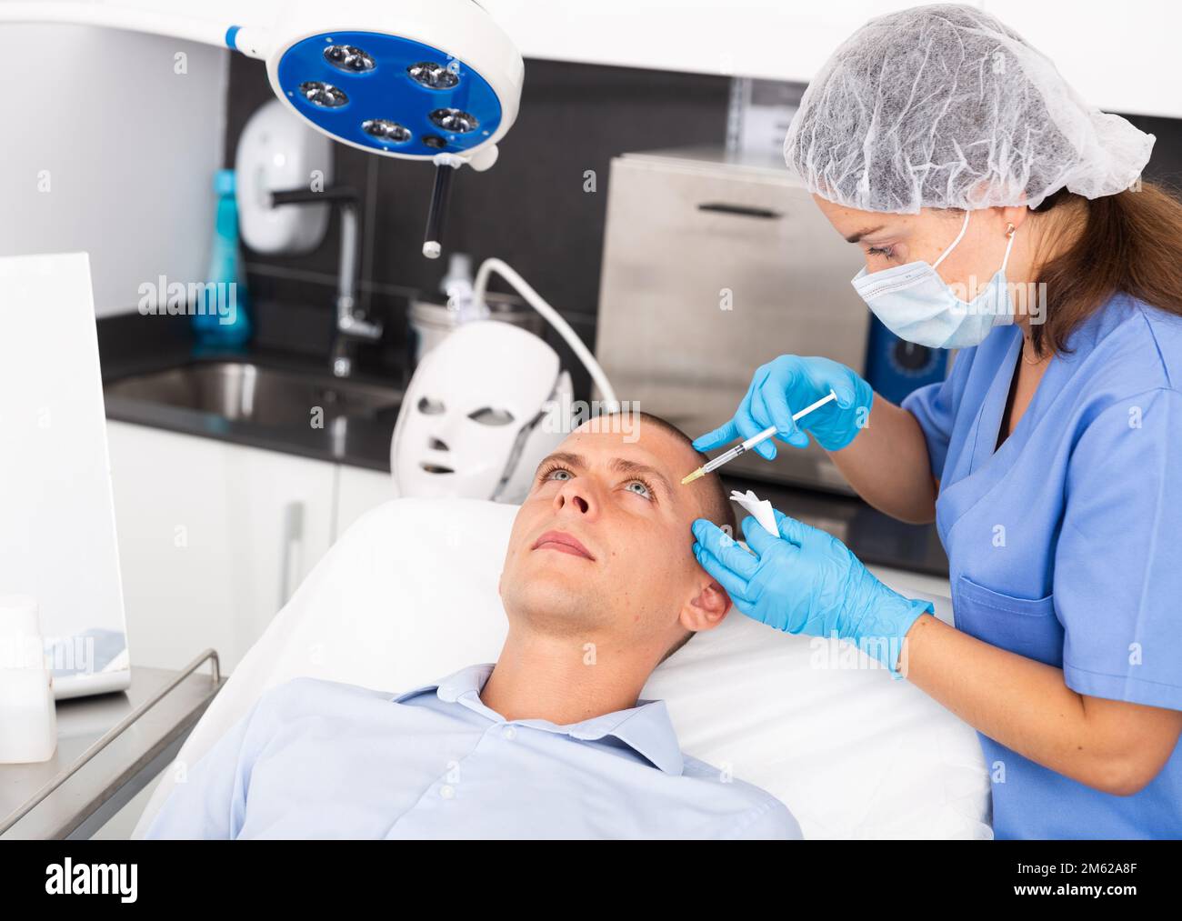 Man getting injections face hi-res stock photography and images - Alamy