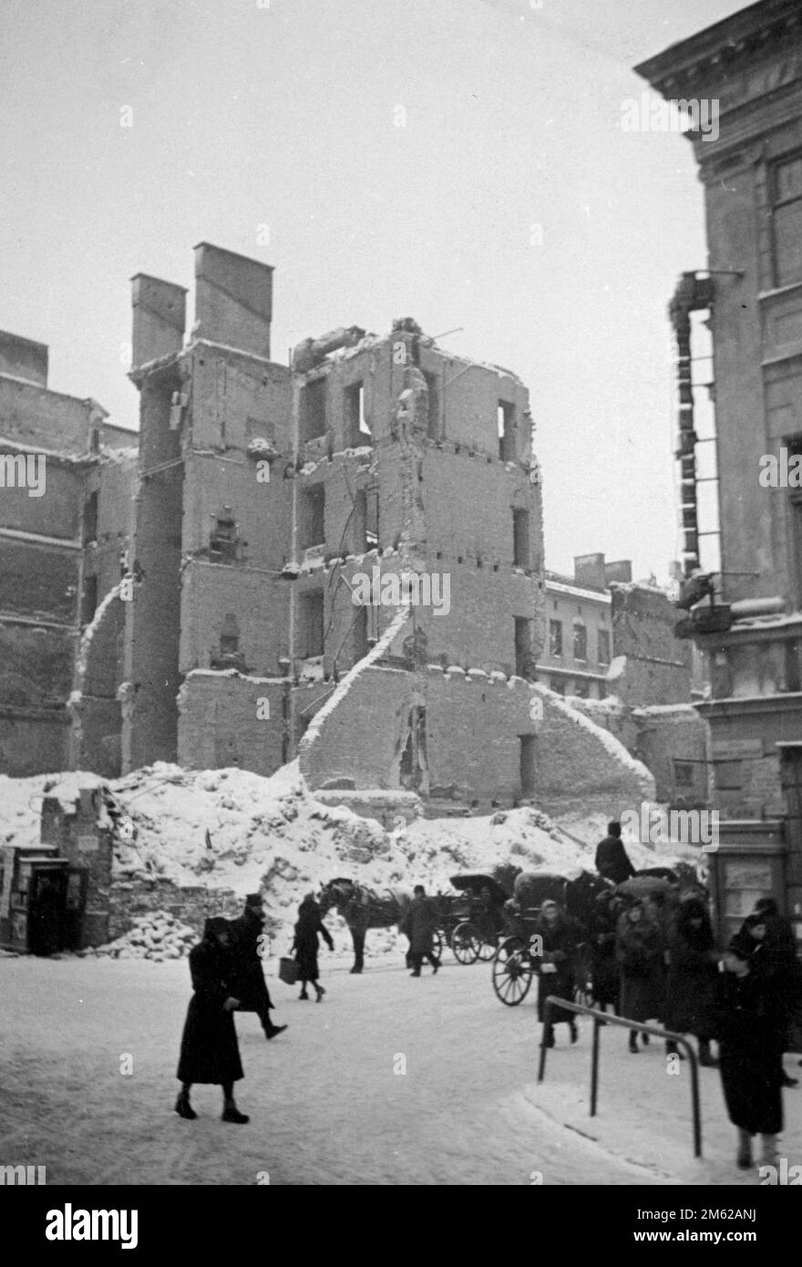 Civilians in the wrecked streets of Warsaw in winter 1939 after the German invasion. Stock Photo