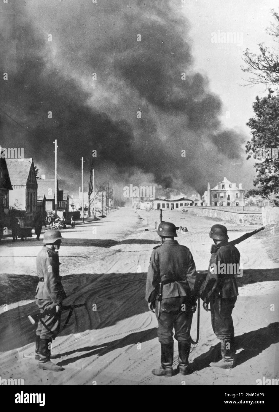 German soldiers in a burning Soviet village during Operation Barbarossa, the nazi invasion of the Soviet Union Stock Photo