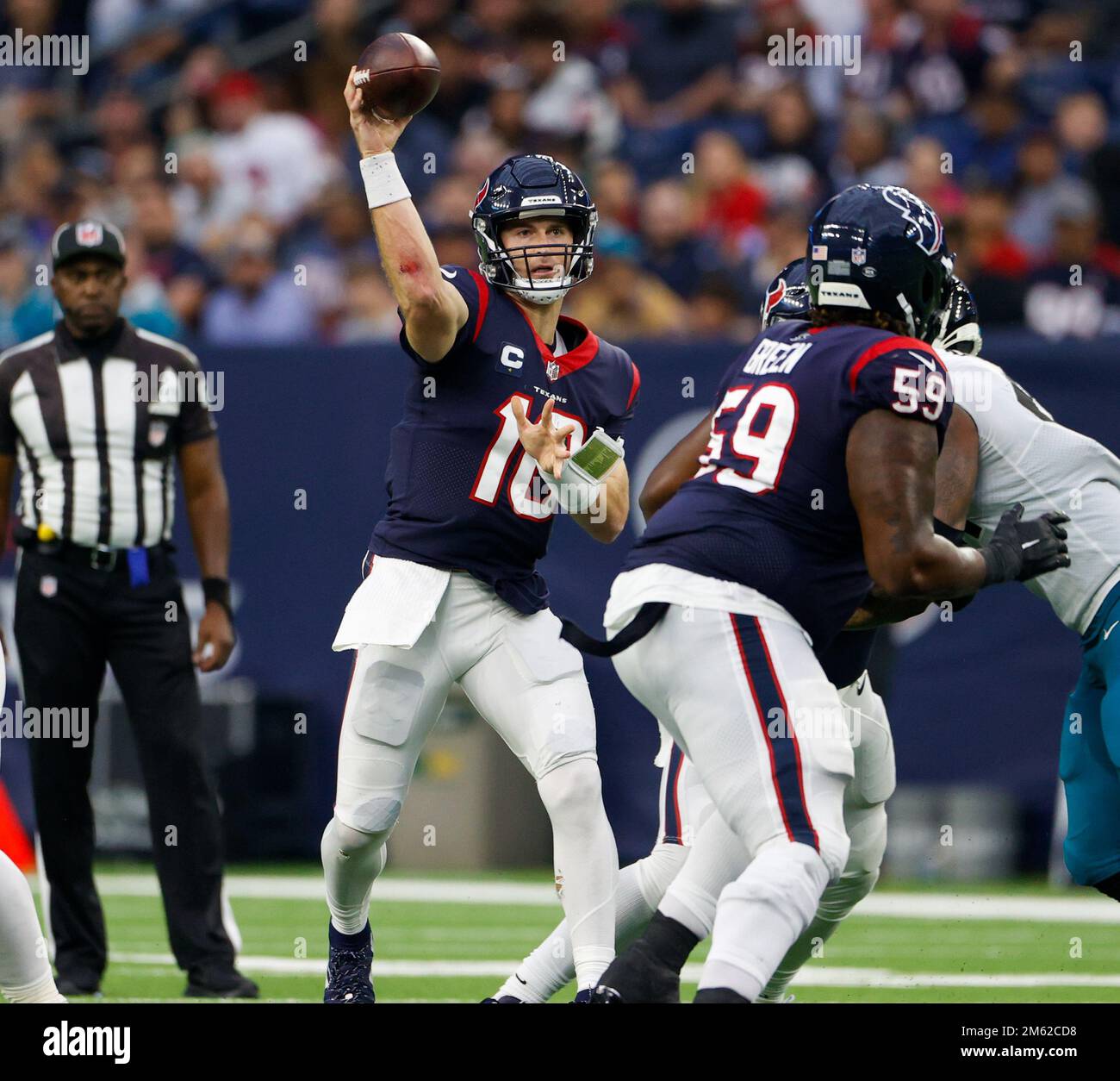 Houston Texans quarterback Davis Mills (10) and NFL referee John