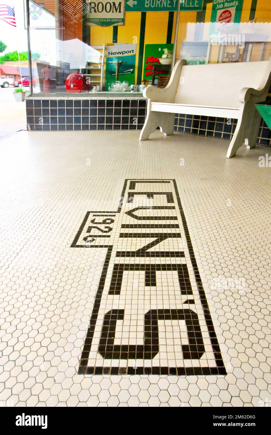 The tiled entry walkway at the historic Levine's building on Main Street in Marietta Oklahoma shows 1926 as the year it was built. Stock Photo