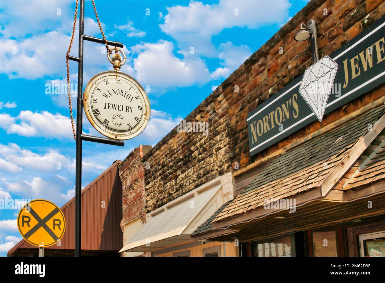 A view of the iconic watch sign outside Norton's Jewelry on Main Street in Marietta Oklahoma.  Norton's also houses the Indian Territory Museum. Stock Photo