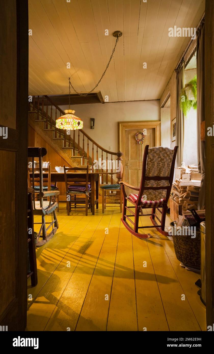 Rocking Inside Table Antique wooden rocking chair and long dining table with chairs in ...