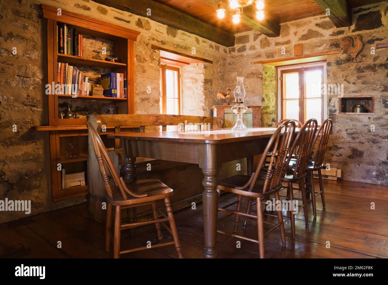 Antique wooden dining table and chairs in dining room inside old circa
