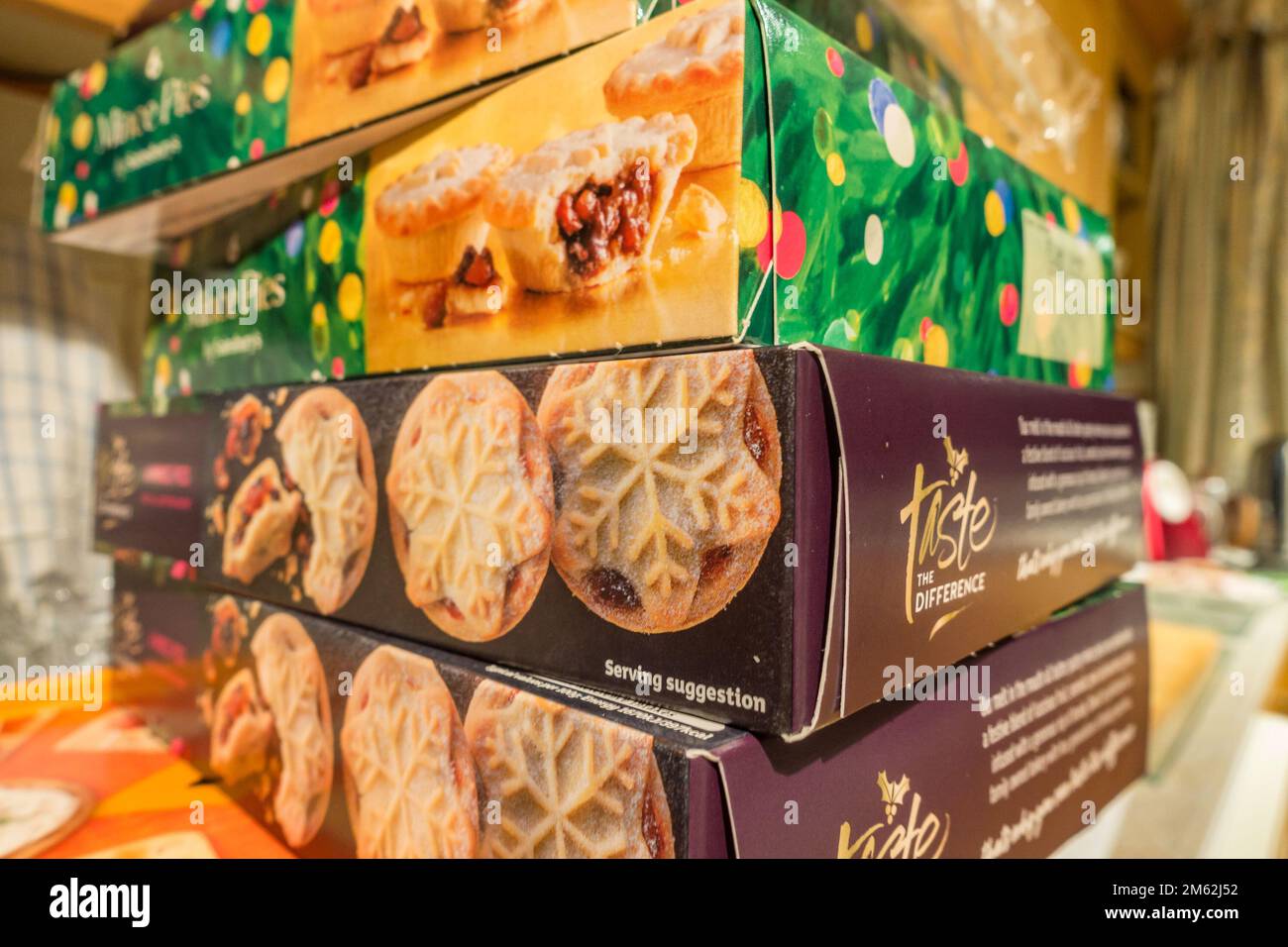 A pile of boxes of shop bought mince pies, a festive treat at Christmas Stock Photo