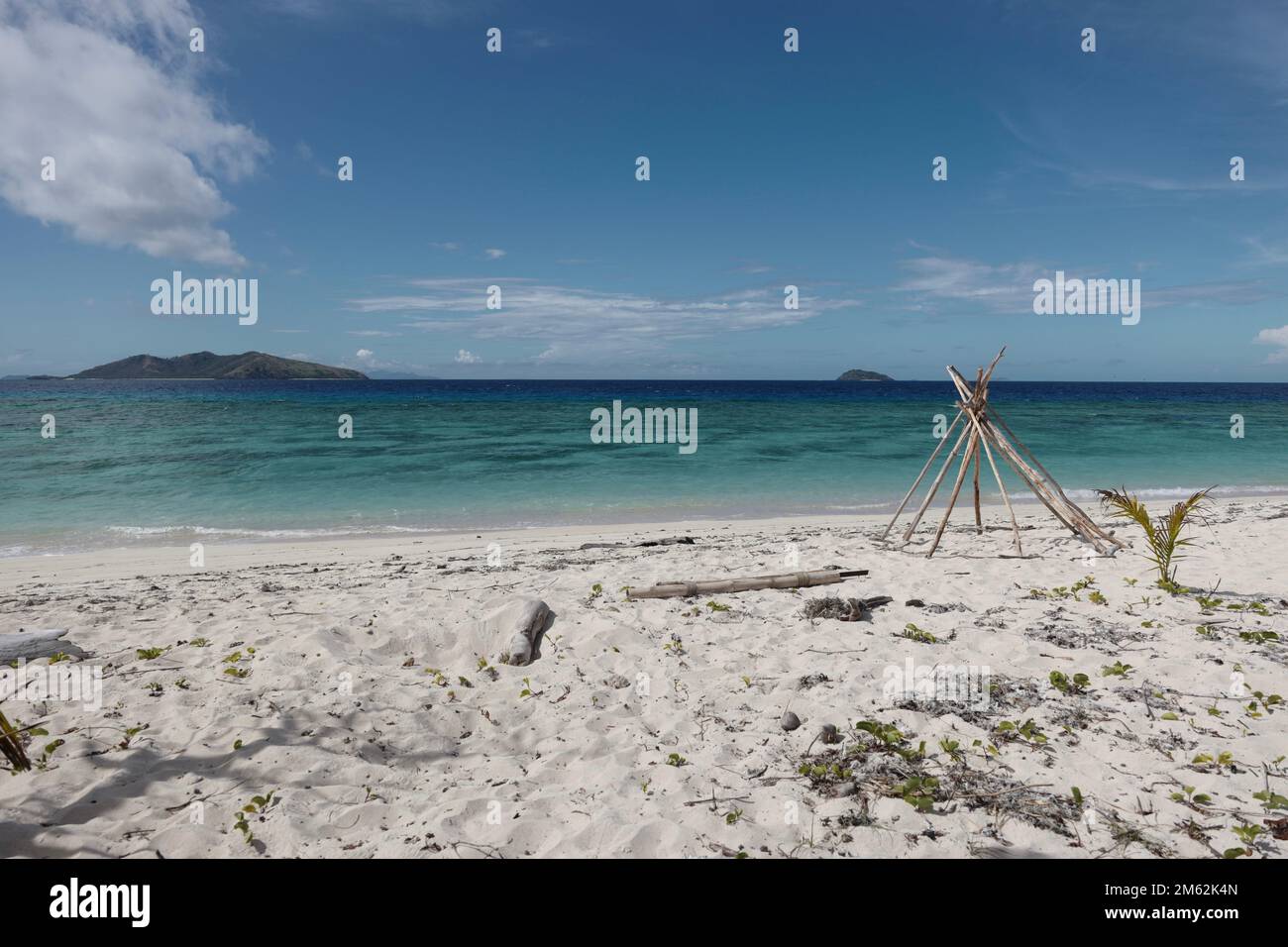 Sandy beach in Fiji with small islands on the horizon Stock Photo - Alamy