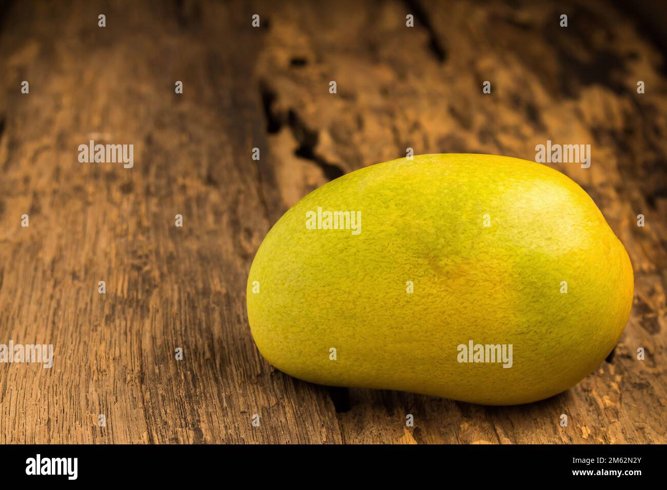mango on a dark wood background. Stock Photo
