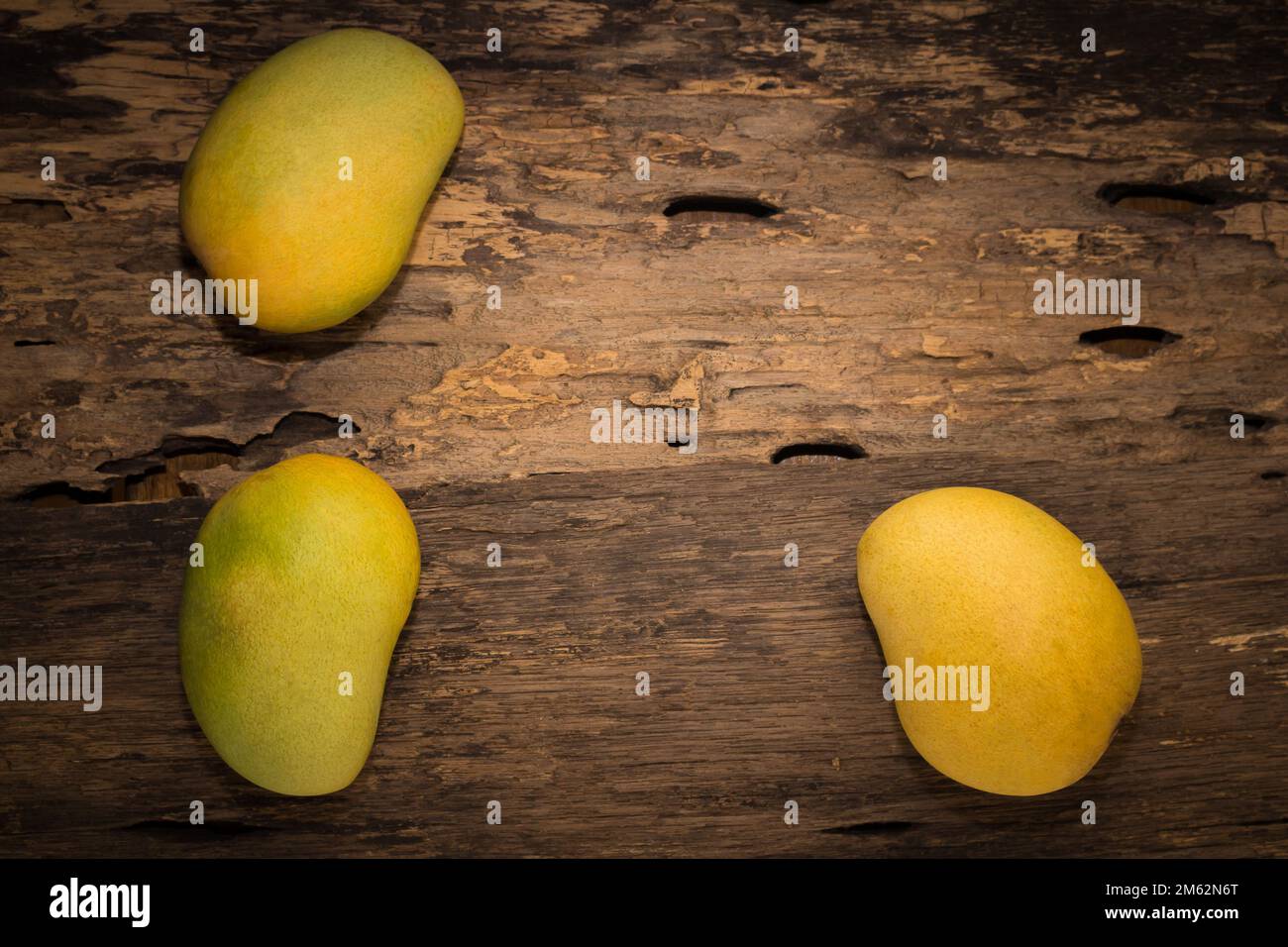mango on a dark wood background. Stock Photo
