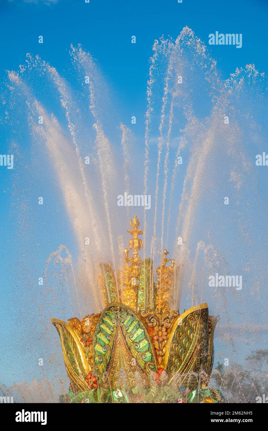 Splashes of water against the blue sky background. Fountain, a jet of ...