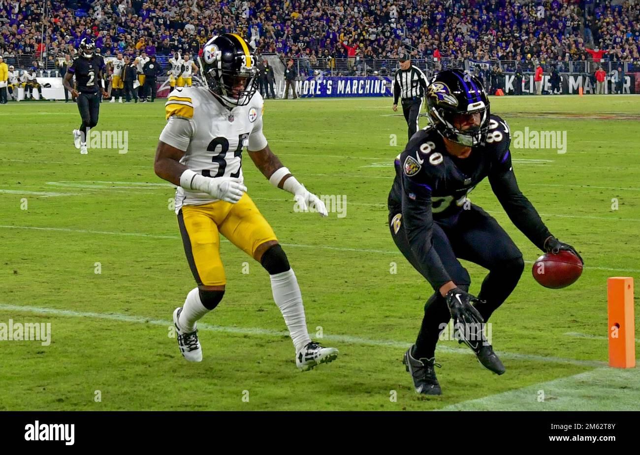 Baltimore, United States. 01st Jan, 2023. Baltimore Ravens tight end Isaiah  Likely (80) is brought down by Pittsburgh Steelers linebacker Robert  Spillane (41) during the first half at M&T Bank Stadium in