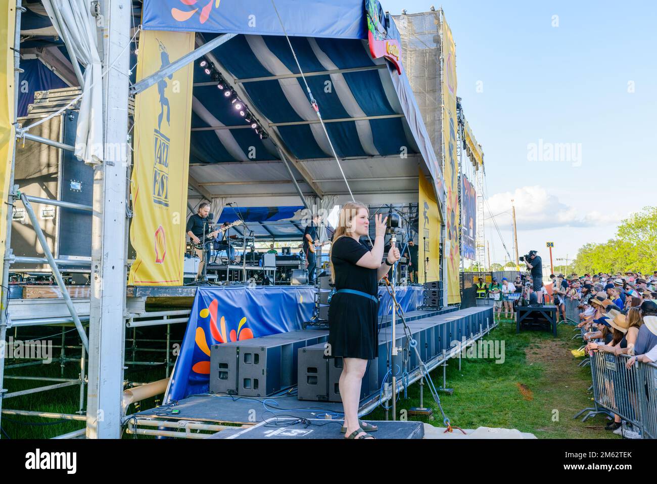 NEW ORLEANS, LA, USA - APRIL 29, 2022: Woman uses American sign language to sign to Death Cab for Cutie at the New Orleans Jazz and Heritage Festival Stock Photo