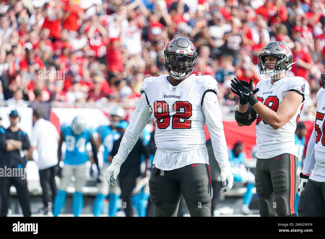 Tampa Bay Buccaneers' William Gholston (92) talks with Tampa Bay Buccaneers'  Rakeem Nunez-Roches (56) before