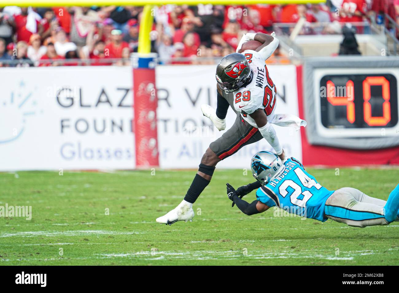 Tampa Bay, Florida, USA, January 1, 2023, Tampa Bay Buccaneers player Rachaad  White #29 jumps to avoid tackle in the fourth quarter at Raymond James  Stadium. (Photo Credit: Marty Jean-Louis) Credit: Marty