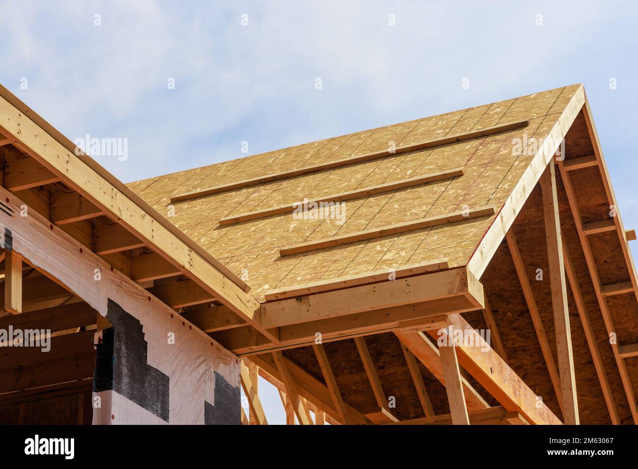 Developing a new house. Roof structure with wooden shingles Stock Photo ...