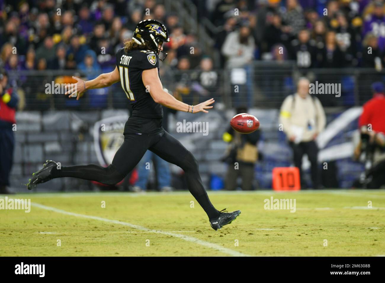 Baltimore Ravens punter Jordan Stout (11) warms up before an NFL