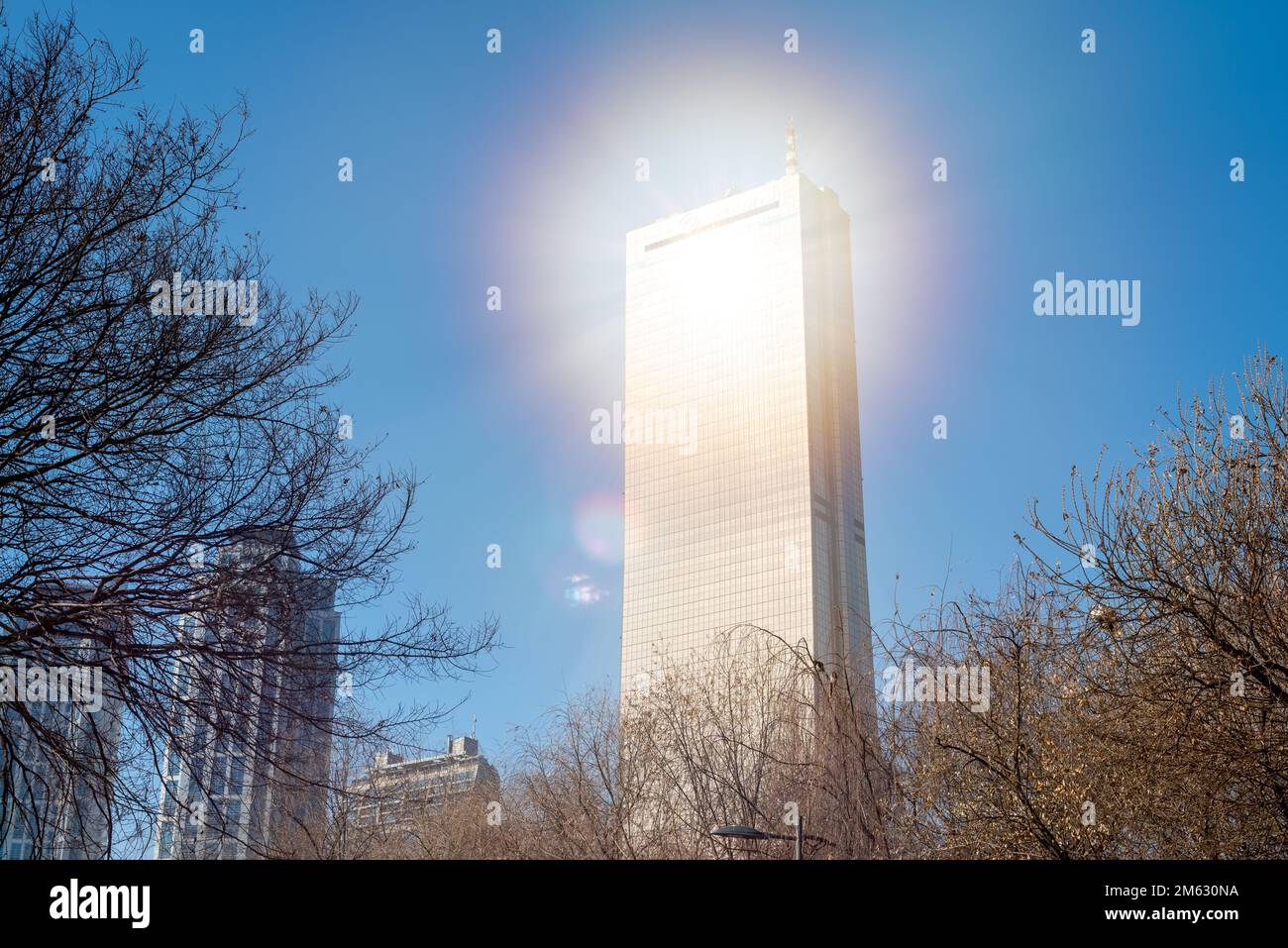 Sunlight reflecting from the gold-tinted glass of the 63 Square building skyscraper on Yeouido island in Seoul, South Korea on 1 January 2023 Stock Photo