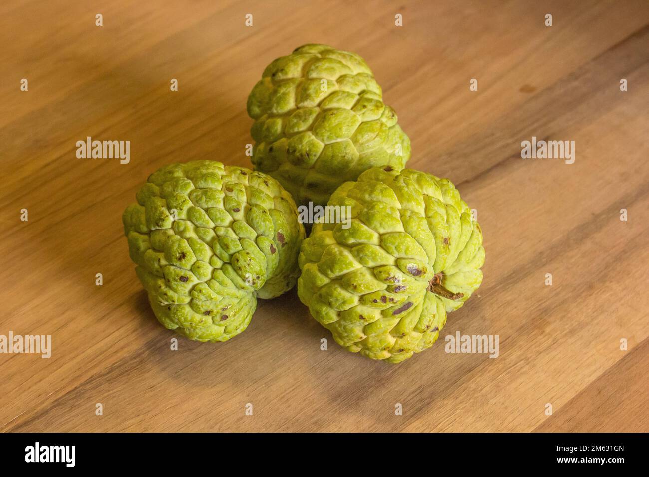 Sugar Apple (custard apple, Annona, sweetsop) on wood Stock Photo - Alamy