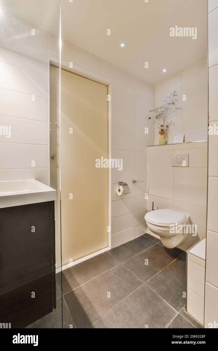 a small bathroom with a toilet and sink in the corner next to it is an