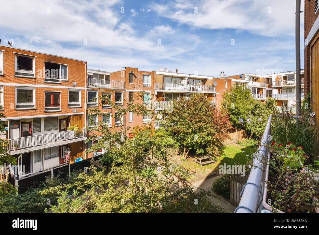 an apartment complex with trees and bushes in the foreground area, melbourne, australia photo by david stott / shutterstocker Stock Photo