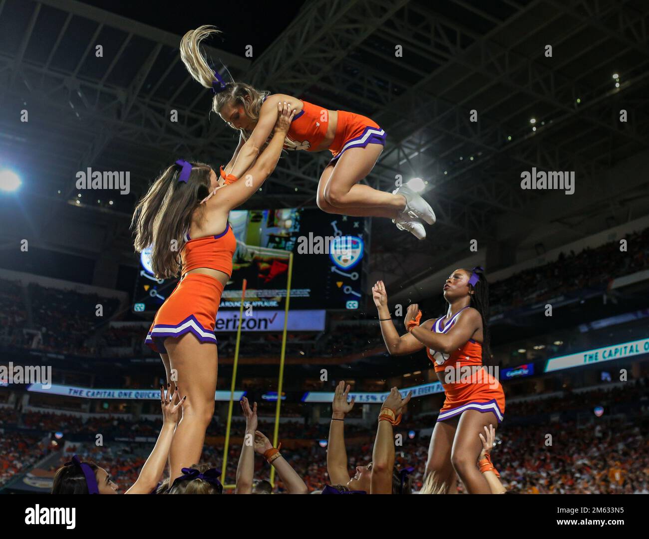 Miami Gardens, FL, USA. 30th Dec, 2022. The Clemson cheerleaders perform a pyramid stunt during the 2022 Capital One Orange Bowl football game between the Clemson Tigers and Tennessee Volunteers at Hard Rock Stadium in Miami Gardens, FL. Kyle Okita/CSM/Alamy Live News Stock Photo