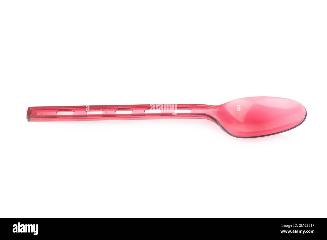 Red plastic spoon isolated on white. Stock Photo