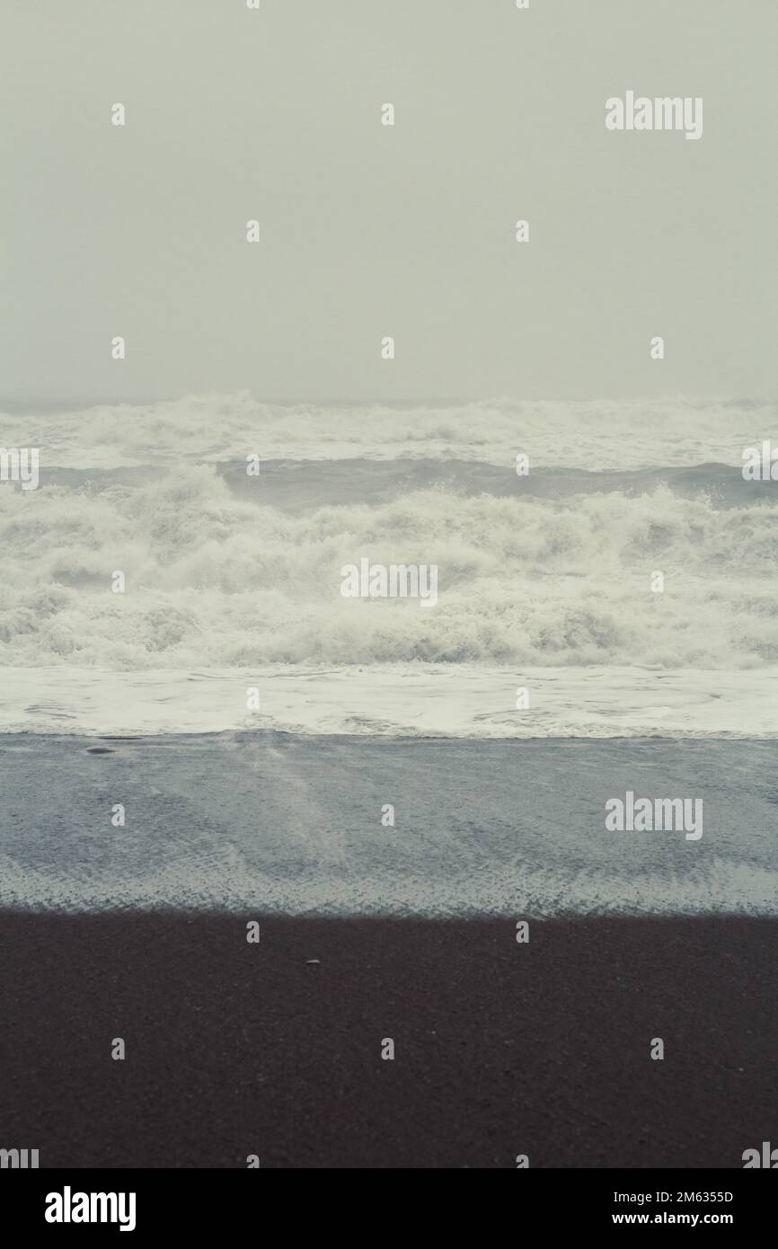 Wet surfline on stormy day landscape photo Stock Photo