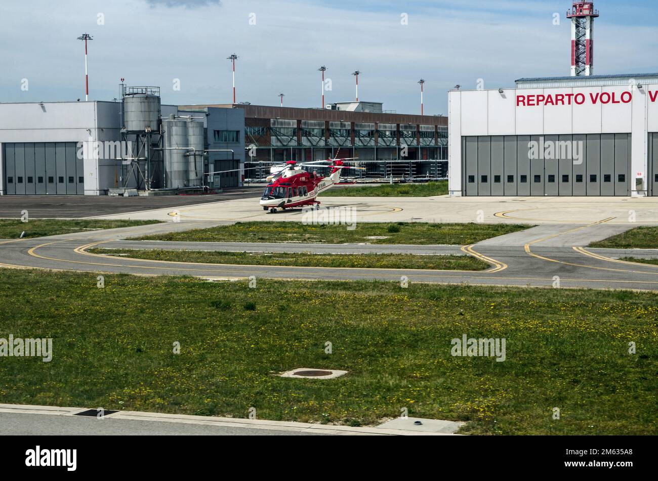 Venice, Italy - April 19, 2-22: A helicopter used by the emergency services on an apron at Marco Polo Airport on a sunny morning in Venice. Stock Photo