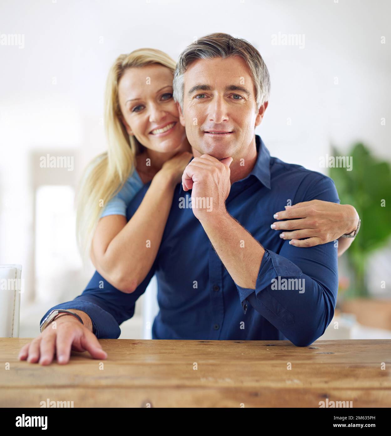 Home is where the heart is. Portrait of an affectionate mature couple at home. Stock Photo