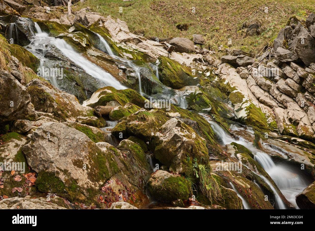 Water going down mountain in Switzerland nature Stock Photo