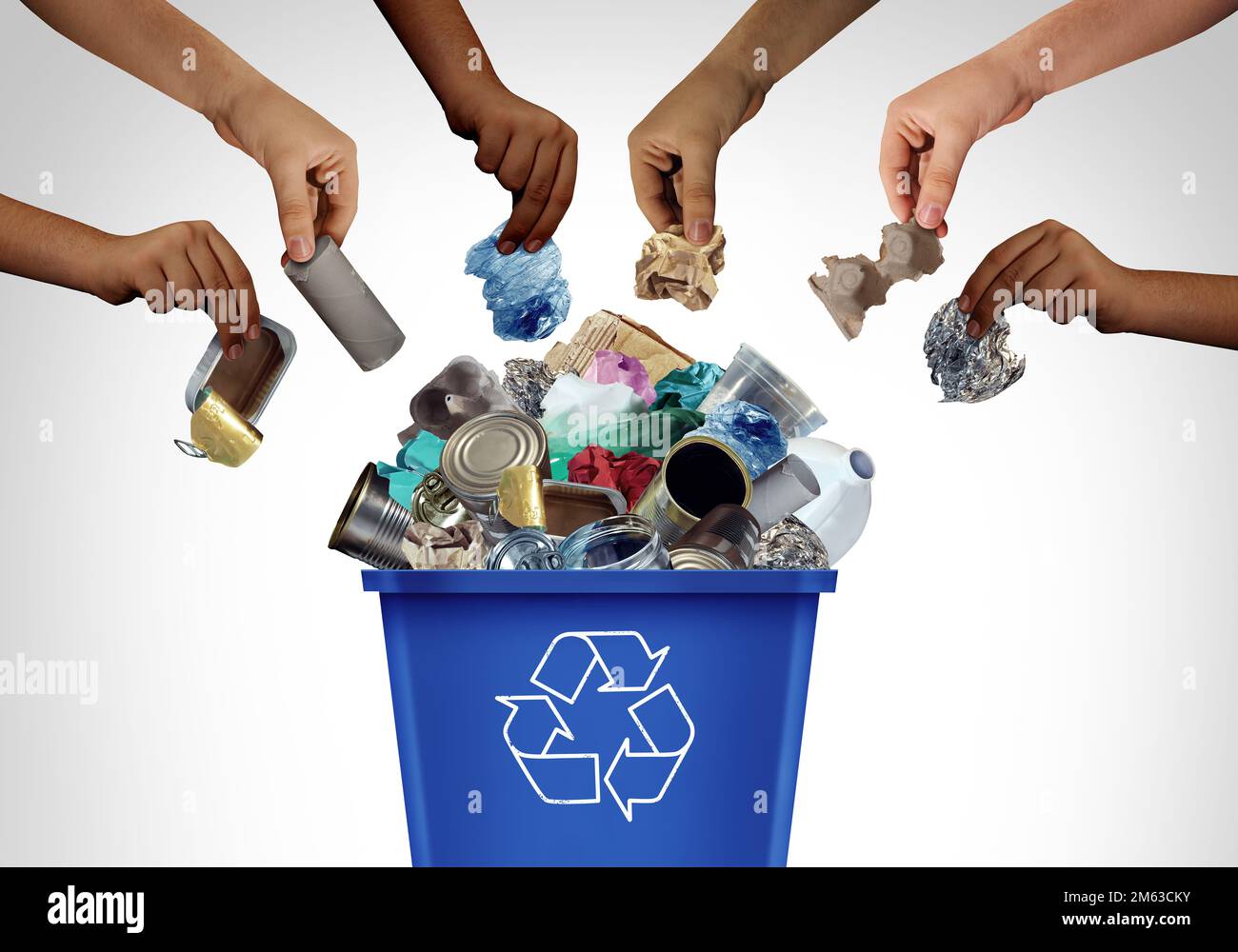 Community Recycling as a Blue Recycling bin to recycle waste and garbage as reusable items management as old paper glass metal and plastic thrown Stock Photo