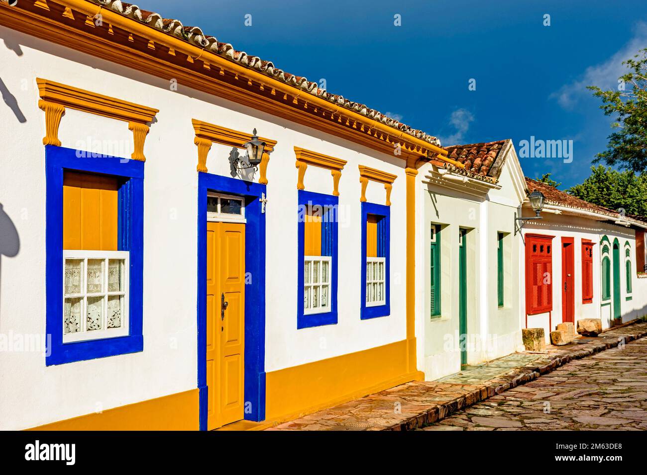 Cobblestone street with old colonial style houses in the city of Tiradentes, Minas Gerais. Stock Photo