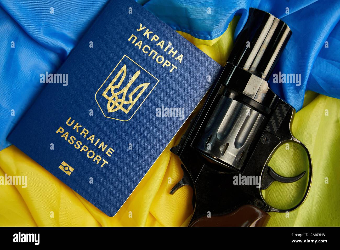 Flag of Ukraine, handgun, passport copy space, russia Ukraine war, Stop war, Freedom, independence country. Stock Photo