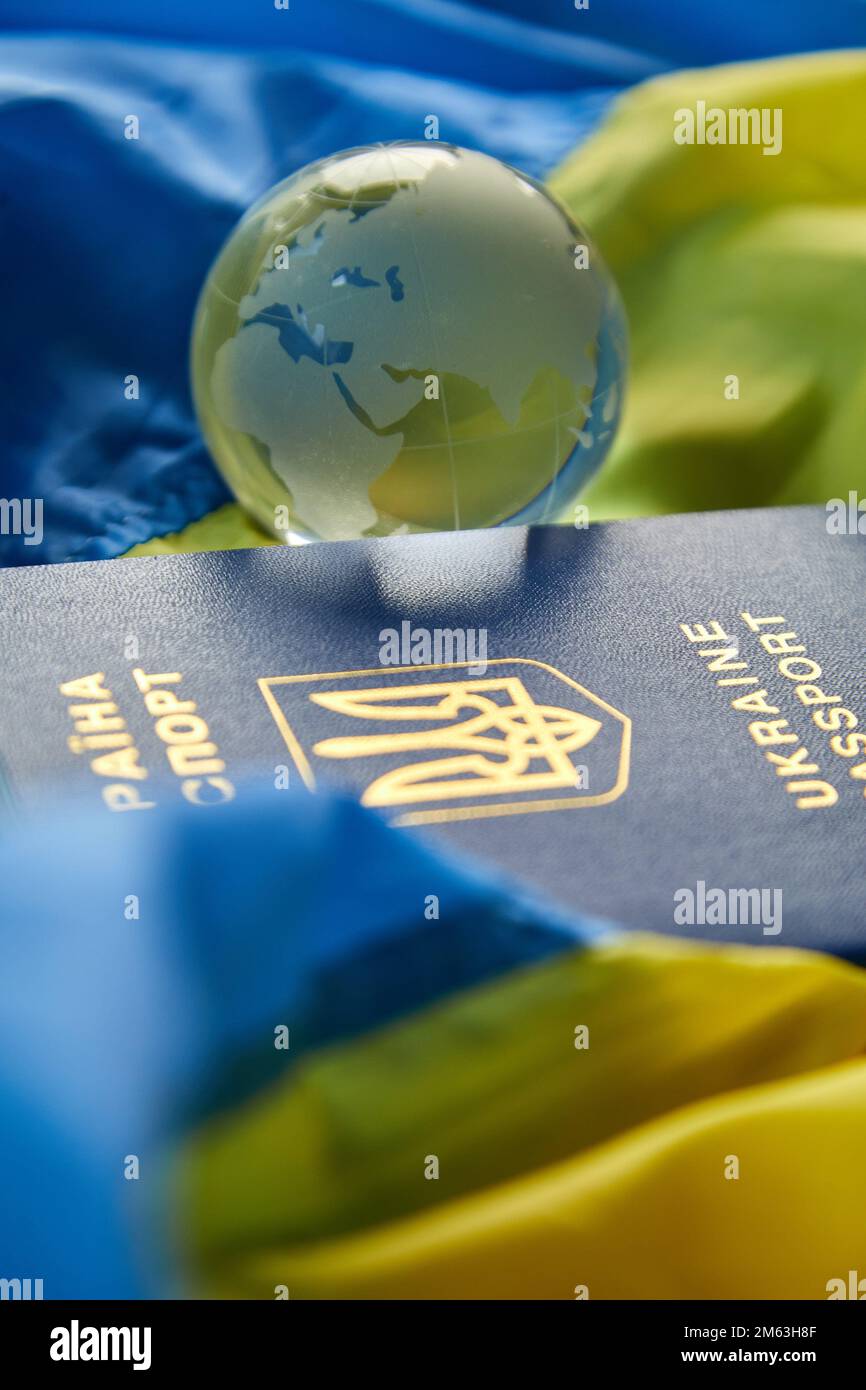 Flag of Ukraine, passport glass globe copy space, russia Ukraine war, Stop war, Freedom, independence country. Stock Photo