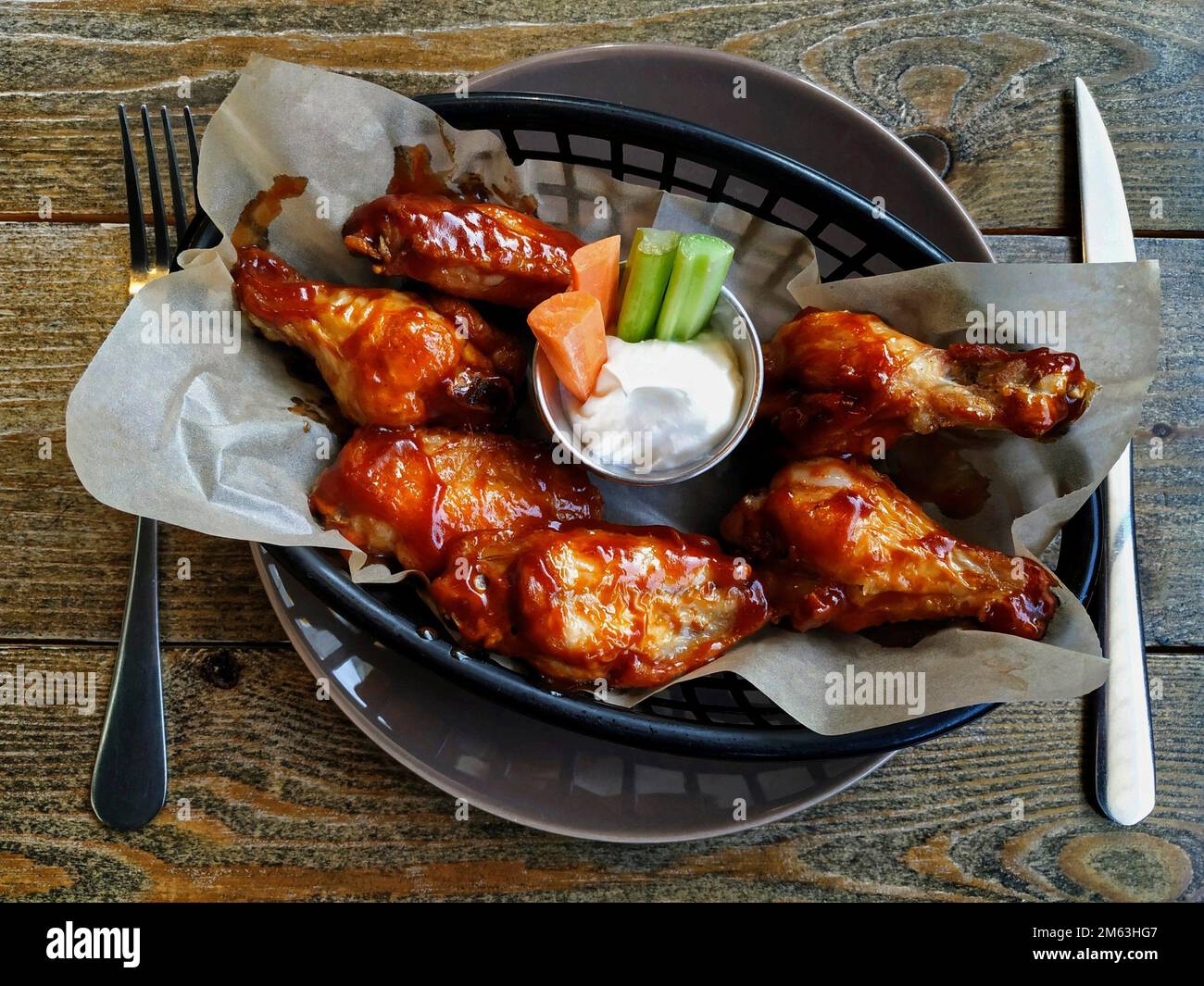 Chicken wings with bbq sauce. Typical dish from United States Stock