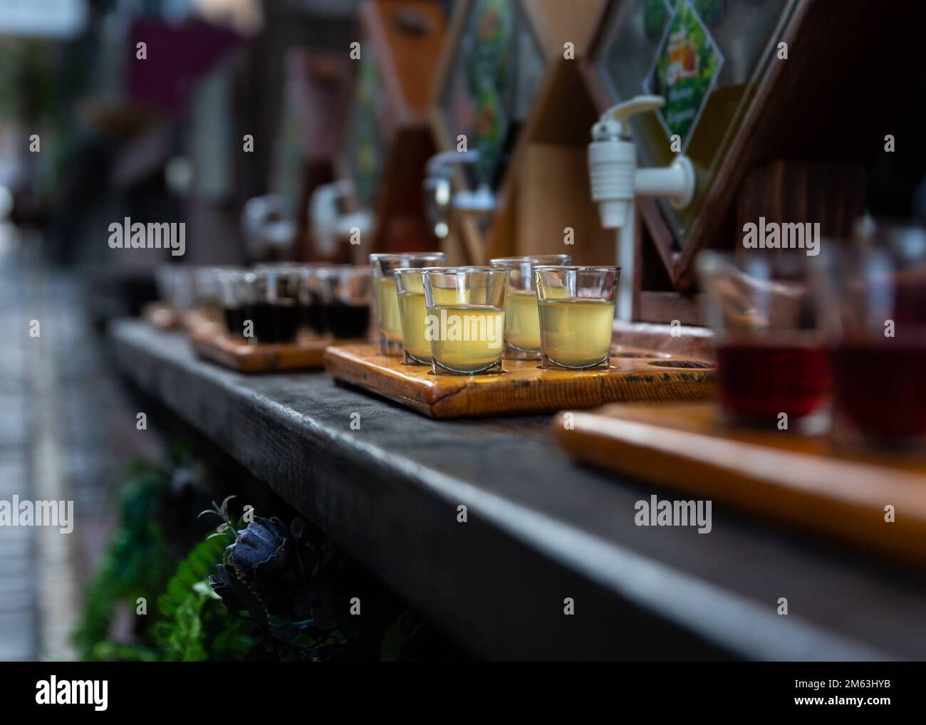 Assortment of hard strong alcoholic drinks and spirits in glasses on bar counter. Stock Photo