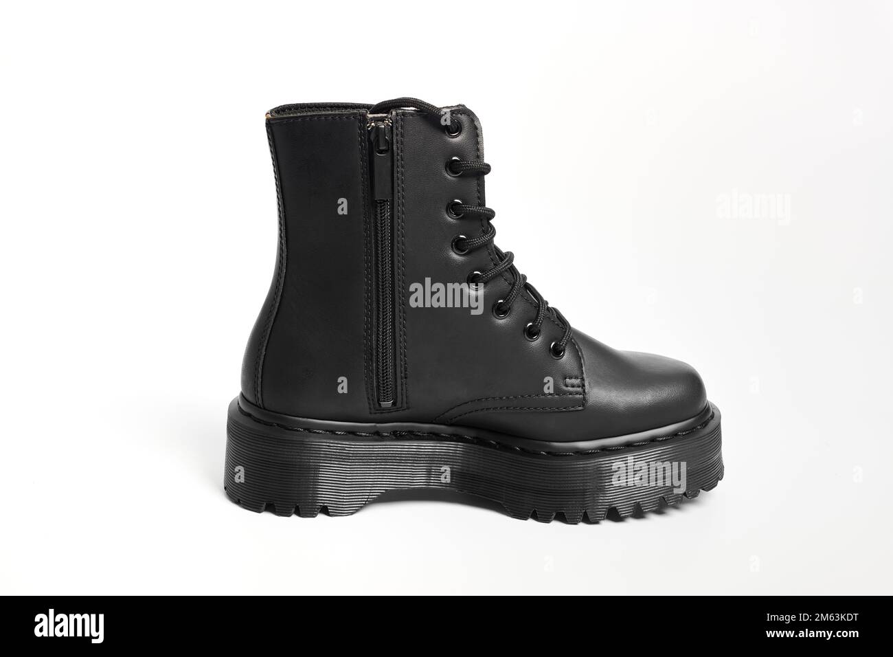 One black women combat boot on high heel platform with lug sole on ...