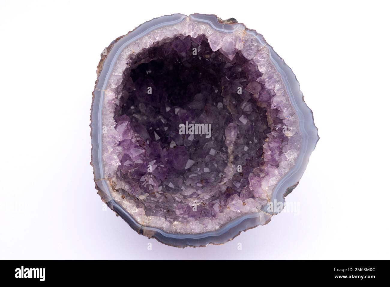 Geode of amethyst. Amethyst is a variety of quartz, semiprecious stone. This sample comes from Brazil. Stock Photo