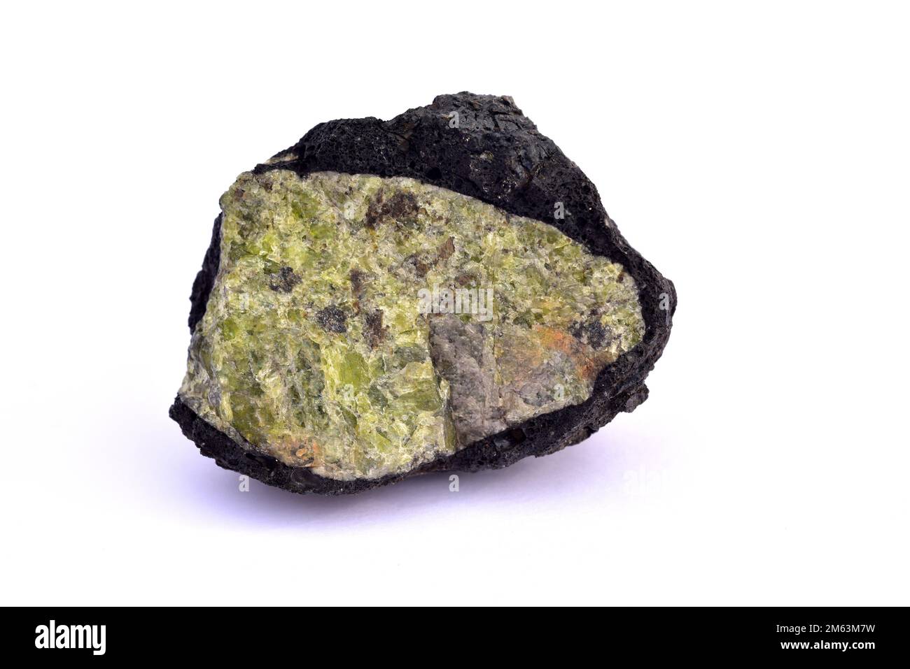 Olivine is a magnesium iron silicate mineral. This samples surrounded