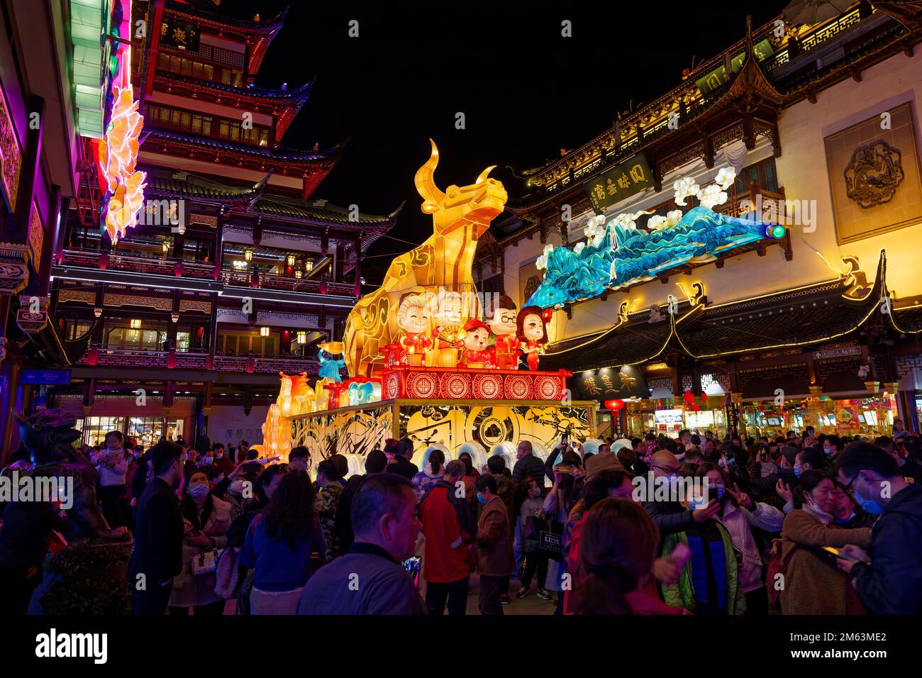 People enjoying the illuminated surroundings in Yuyuang Bazaar in Shanghai during Chinese New Year. Stock Photo