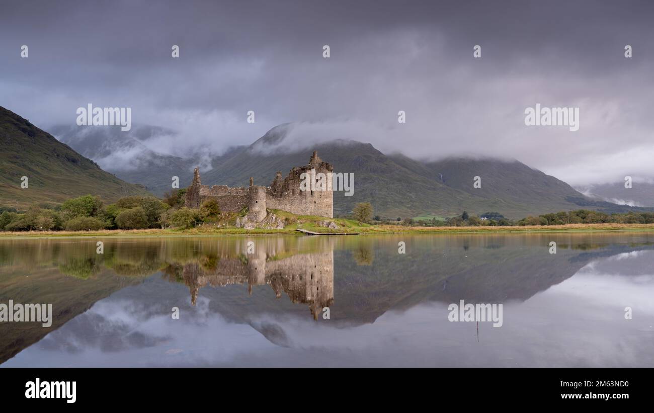 Kilchurn Castle on Loch Awe, Historic Scottish Castle reflected in the loch. Close to Glasgow and Glencoe, famous for whiskey distilleries and rugged Stock Photo