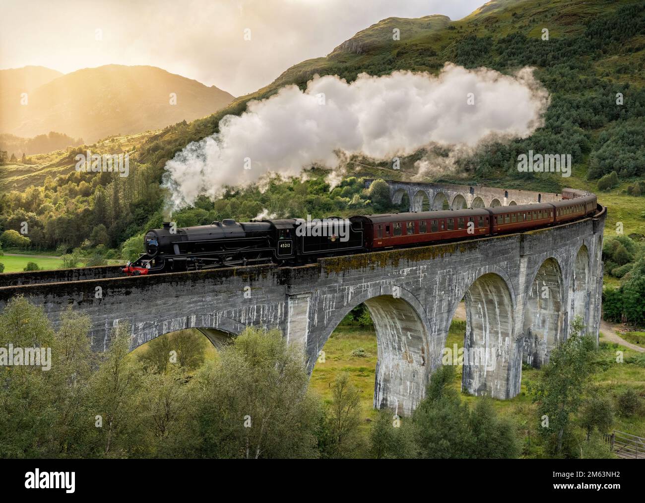 Steam train crossing the Glenfinnan viaduct in the Scottish Highlands