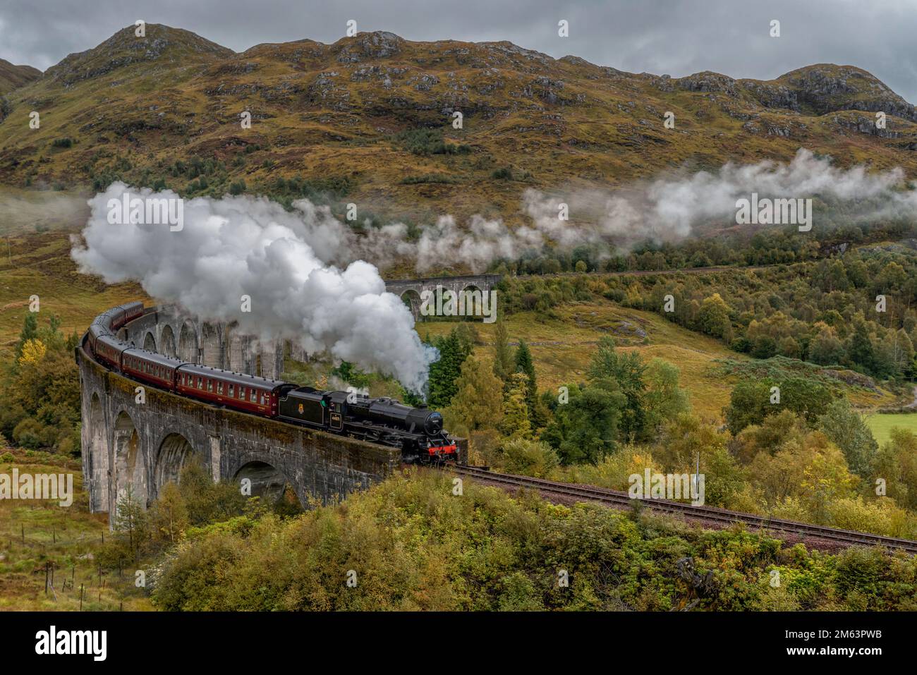 Glenfinnan steam train crossing the famous bridge in the Scottish