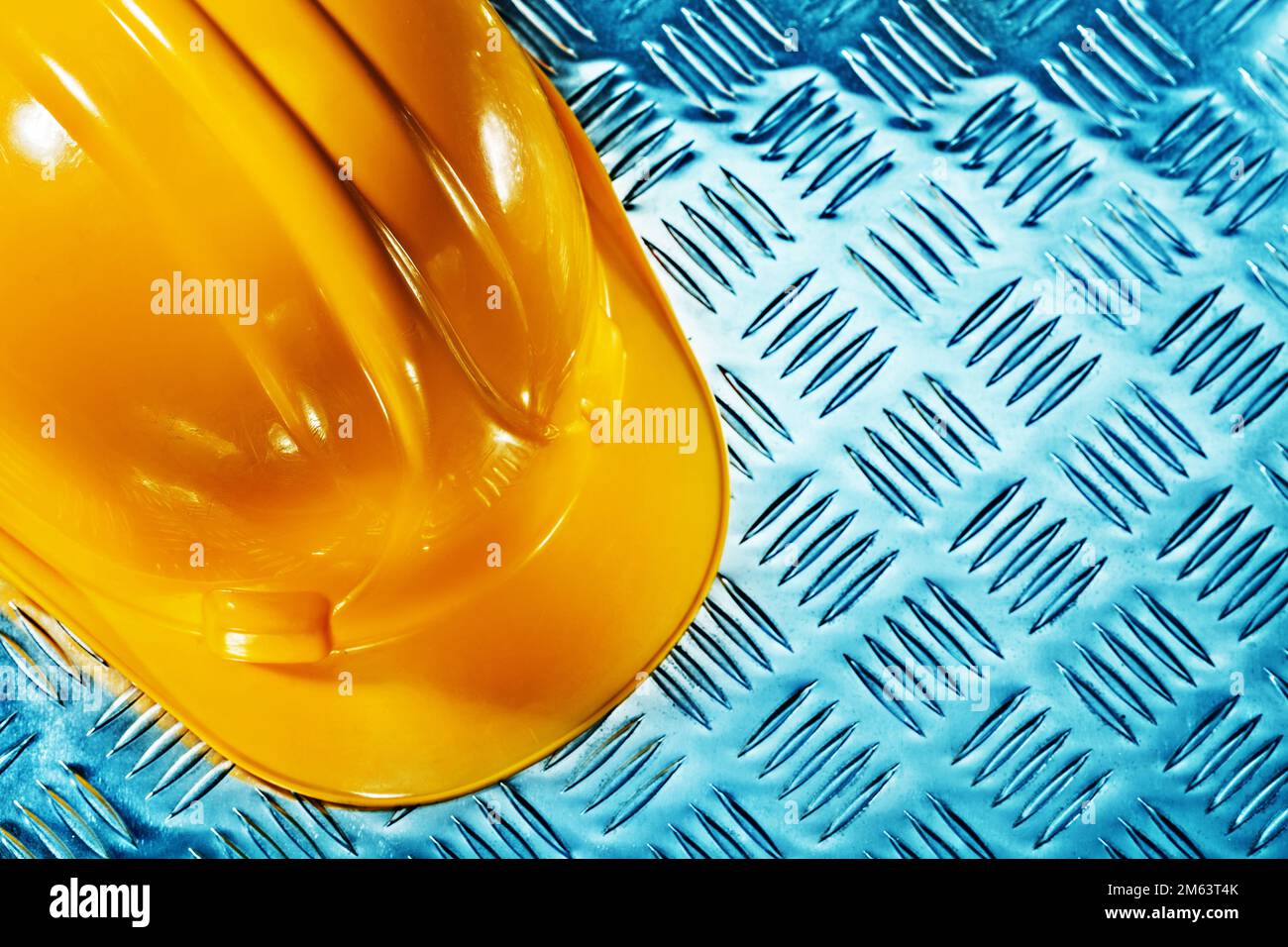 yellow halmet on corrugated metallic sheet Stock Photo Alamy
