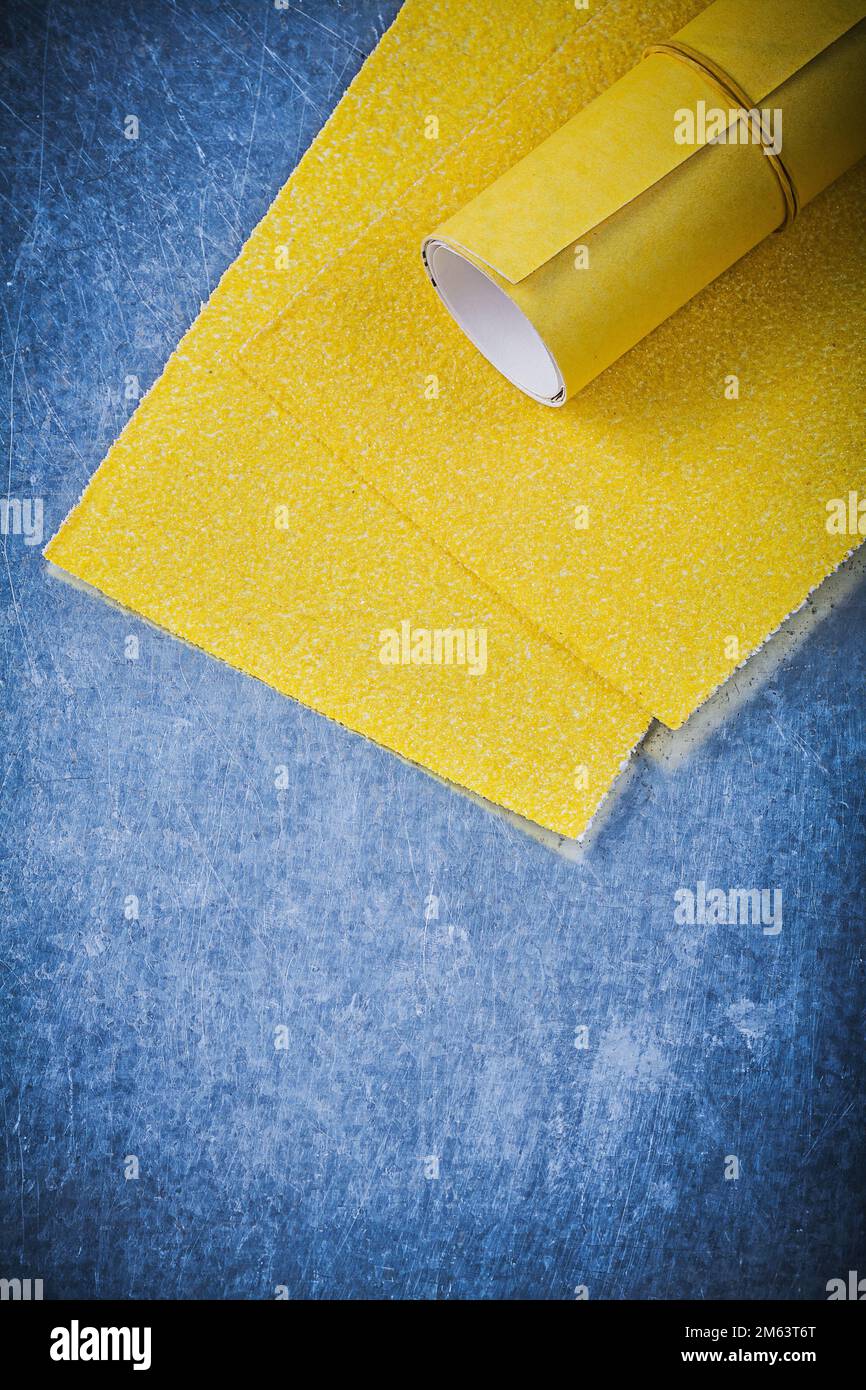 Yellow sandpaper on metallic background abrasive tools Stock Photo Alamy