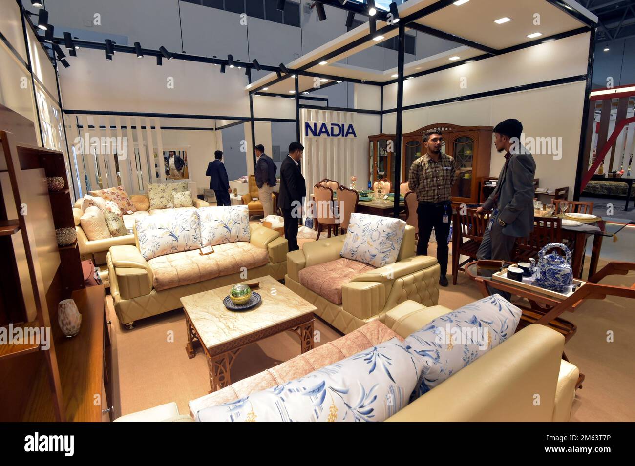 Dhaka. 2nd Jan, 2023. Visitors look at furniture at a stall during the Dhaka International Trade