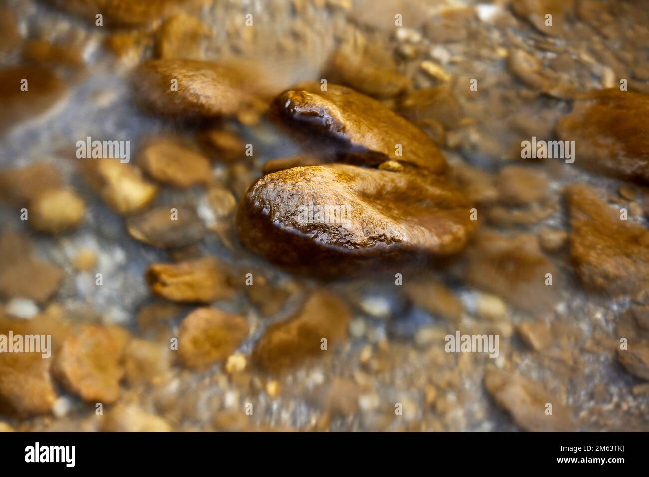 Large rocks in a river in Switzerland nature Stock Photo - Alamy