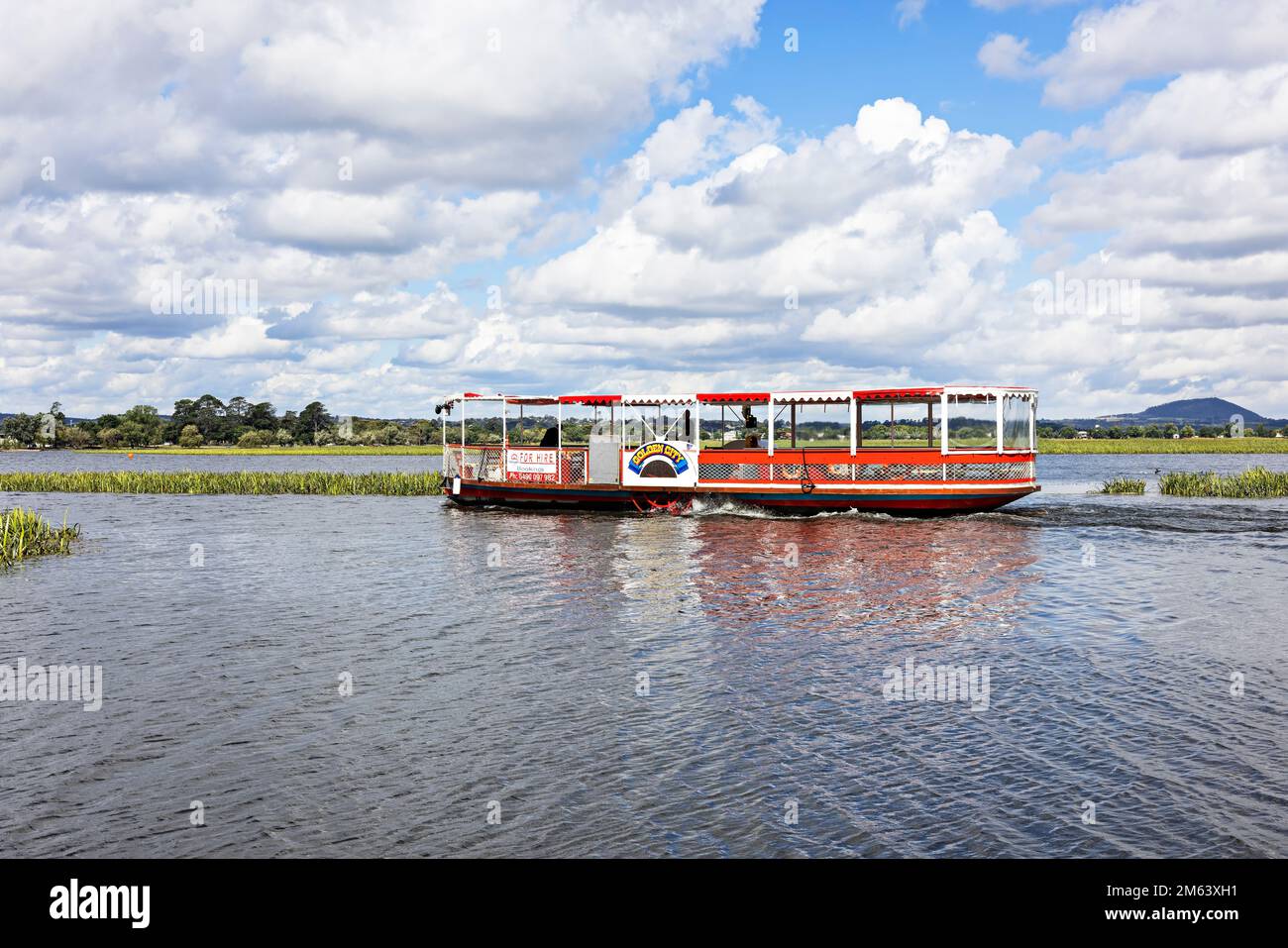 Ballarat Australia /  The Golden City Paddle Boat  heads back to the boatshed after a busy day  touring  Lake Wendouree. The Paddle Boat is a replica Stock Photo