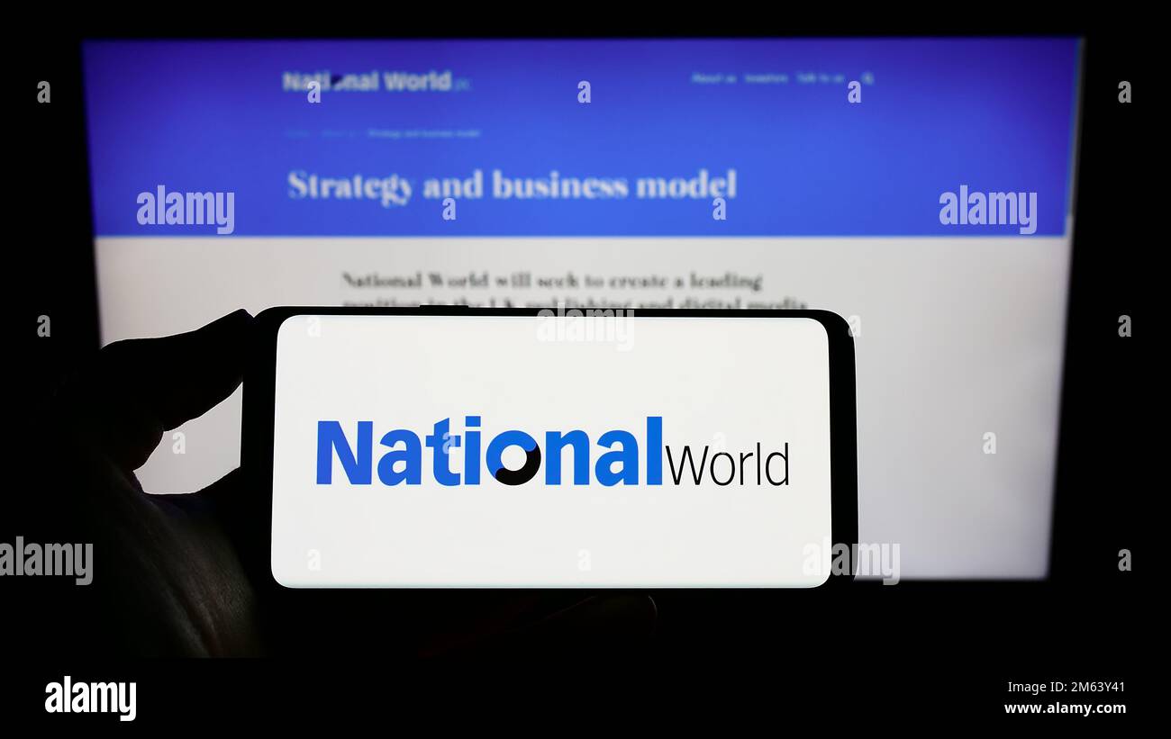 Person Holding Mobile Phone With Logo Of British Media Company National ...