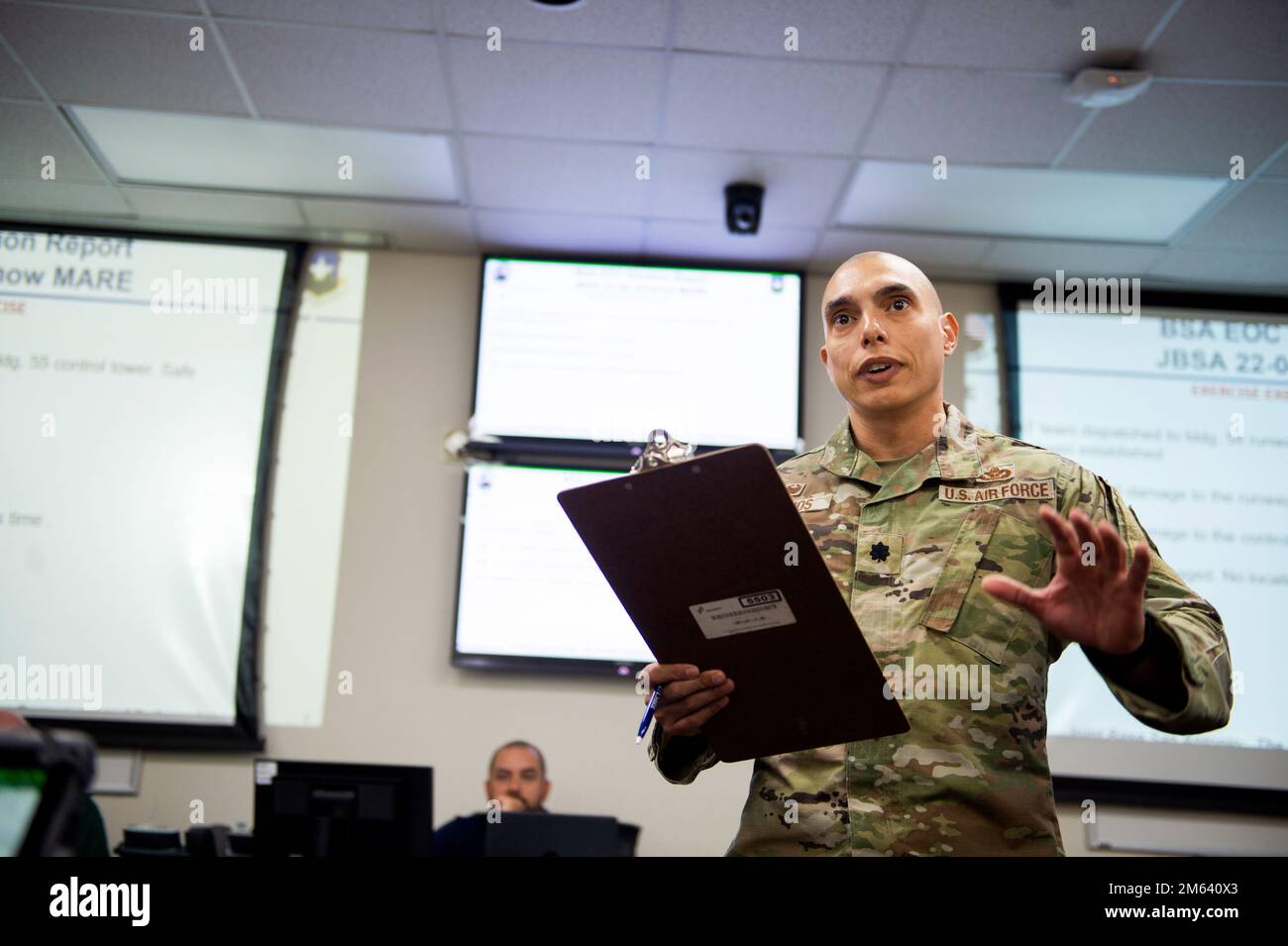 U.S. Lt. Col. Clemente Berrios, Emergency Operations Center director and 902nd Civil Engineer Squadron commander, addresses staff of the Crisis Action Team during a Major Accident Response Exercise, Mar. 30, 2022, at Joint Base San Antonio-Randolph, Texas. MAREs demonstrate JBSA’s Disaster Response Forces ability to assess and respond to an aircraft mishap. The 502nd Air Base Wing worked alongside the Schertz Fire Department, 12th Flying Training Wing and the 59th Medical Wing validate the necessary support during a simulated accident. Stock Photo