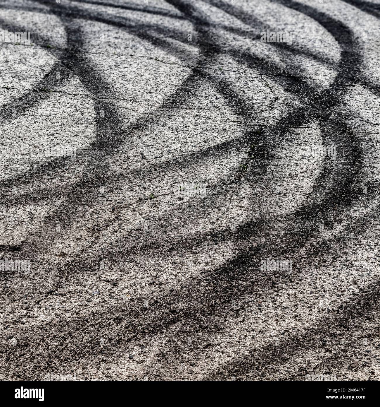 Black tracks on the pavement from a drift car. Stock Photo